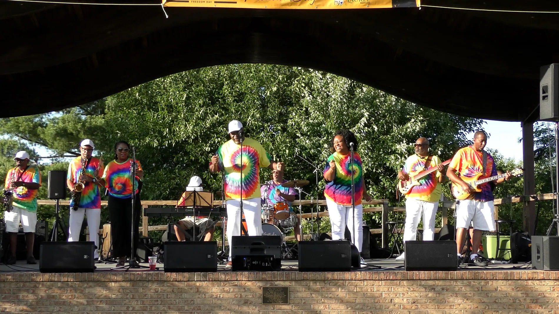 Decade’s Band performing outdoors at a festival