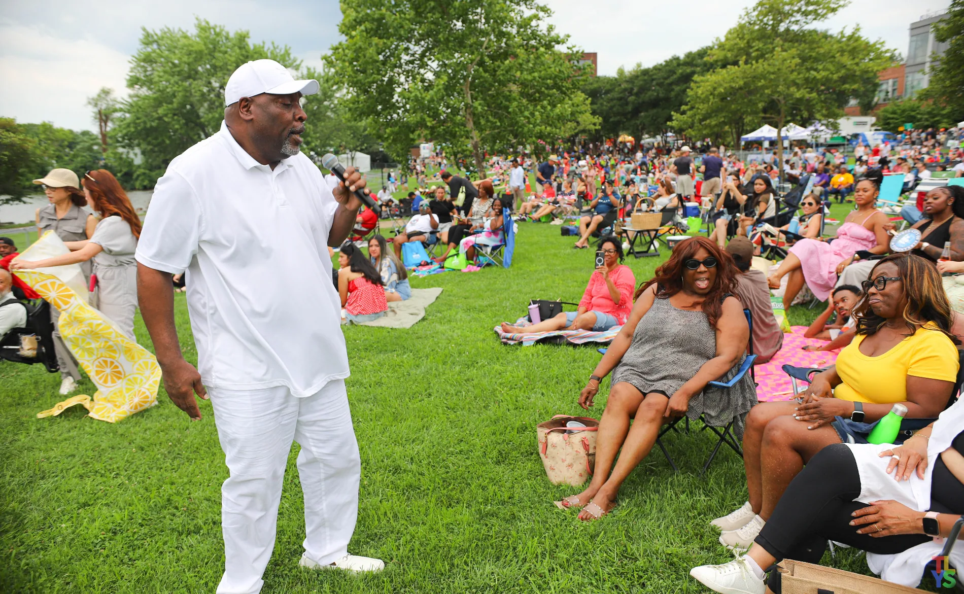 Vocalist engaging the audience at an outdoor event